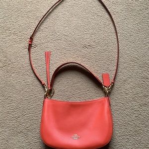 Coach bag. Peach bag with gold accents. Bag size 11” wide by 7.5” high